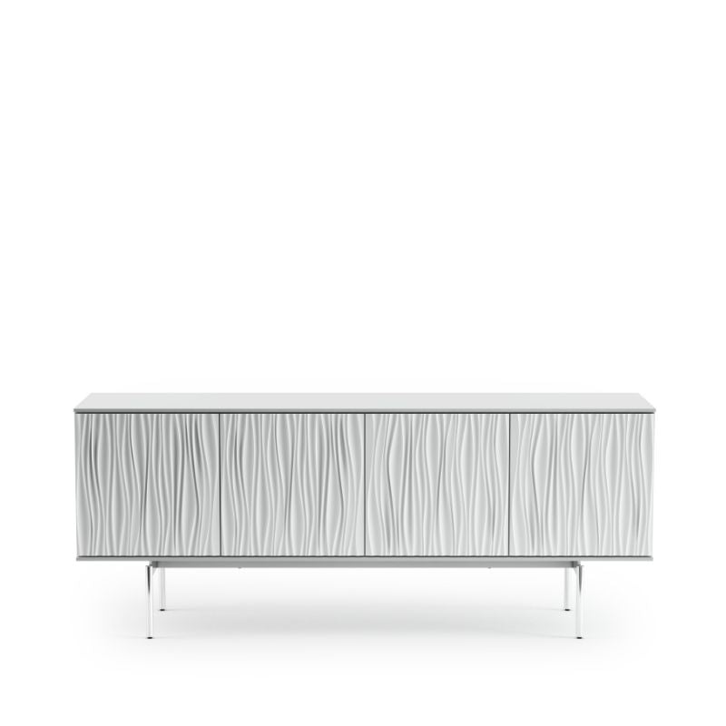 Contrasting straight lines with flowing, sculpted patterns, the stunning design of the Tanami credenza, media console, and storage cabinet is sure to be the focal point of any room. Polished chrome legs provide a distinctly modern and minimalist look, while features such as adjustable shelves and built-in cable management make it perfectly suitable for light AV and media use. Also available as a triple-width,shop at  www.furniturewonderland.co.uk